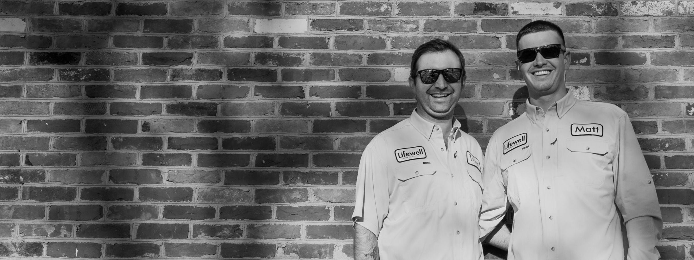 Lifewell Water Solutions co-founders Tyler Gilmore and Matt Sovero in Lifewell uniforms